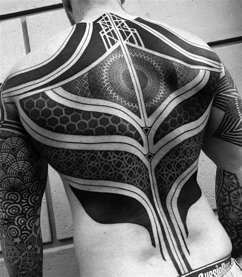 10 Artists Who Create Striking Geometric Tattoos Spanning The Body