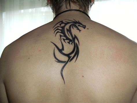 22 Beautiful Tribal Dragon Tattoo