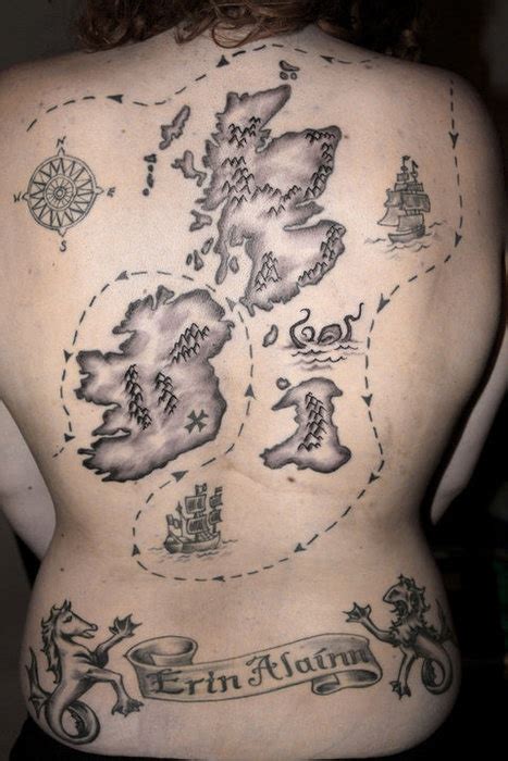 A Black And White Photo Of A Map Tattoo