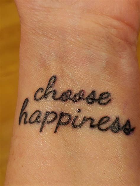 A Wrist Tattoo That Says Choose Happiness