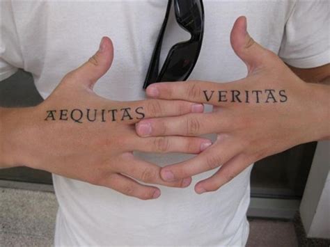 Aequita Verita Hand Tattoo