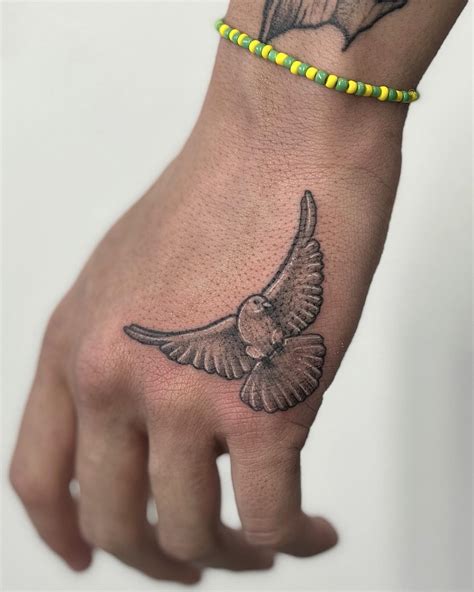 Aggregate More Than 77 Small Dove Hand Tattoo In Cdgdbentre