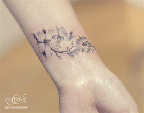 Amazing And Delicate Flower Tattoo On A Womans Wrist Subtle Tattoos