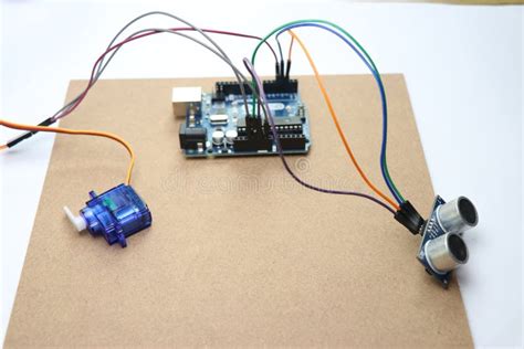 Arduino Uno Project Made From Micro Servo And Ultrasonic Sensor Connected Using Jumper Wires