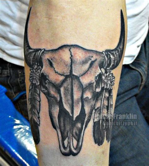 Buffalo Skull With Feathers Tattoo