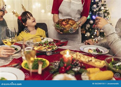 Family Enjoying In A Lunch Together At Home Family On Christmas Dinner