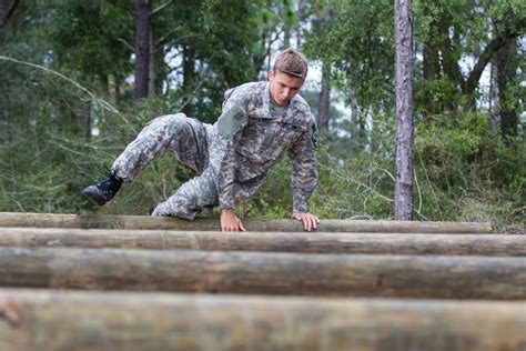 File An Army Junior Officer Training Corps Cadet Navigates A Log Hurdle