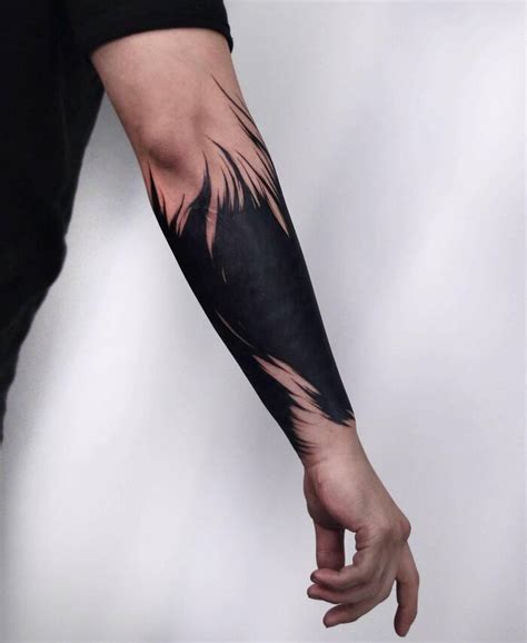 10 Forearm Blackout Tattoo Designs to Make a Statement