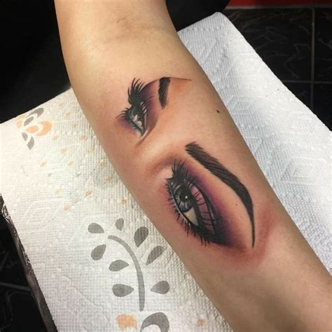 Girl Eyes Tattoo On Arm