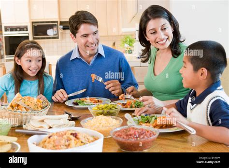 Happy Family Enjoying Lunch Time Together Stock Photo Image Of Meal