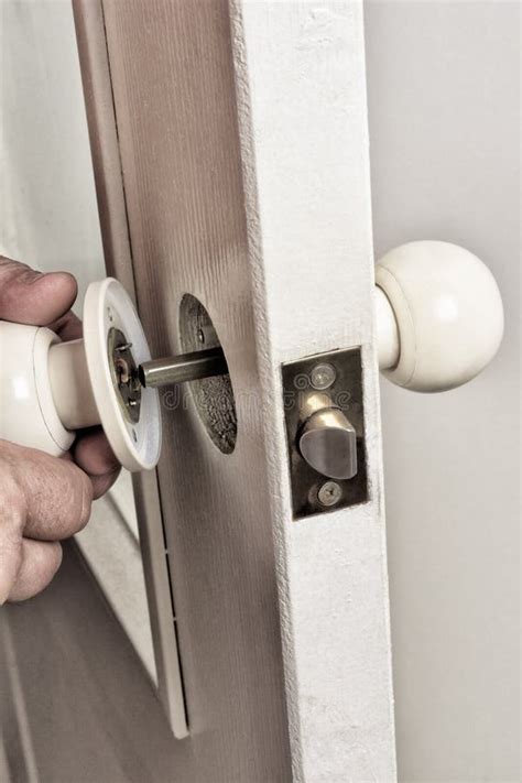 Install Latch With A Screwdriver On The Door Stock Image Image Of