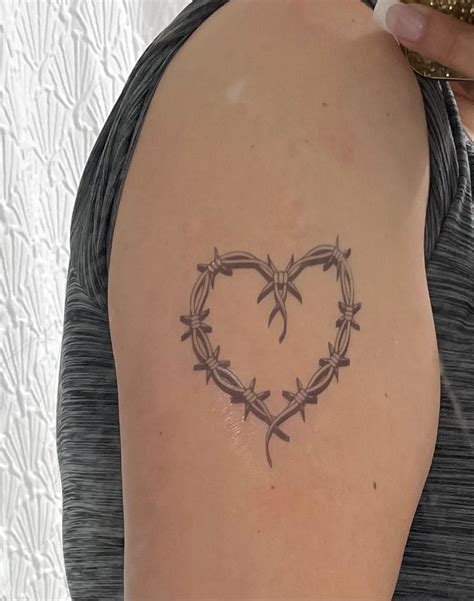 5 Secrets Behind Karol G's Heart Tattoo Meaning