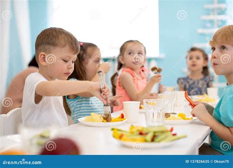 Kids Enjoying Healthy Lunch In Kindergarten Stock Image Image Of