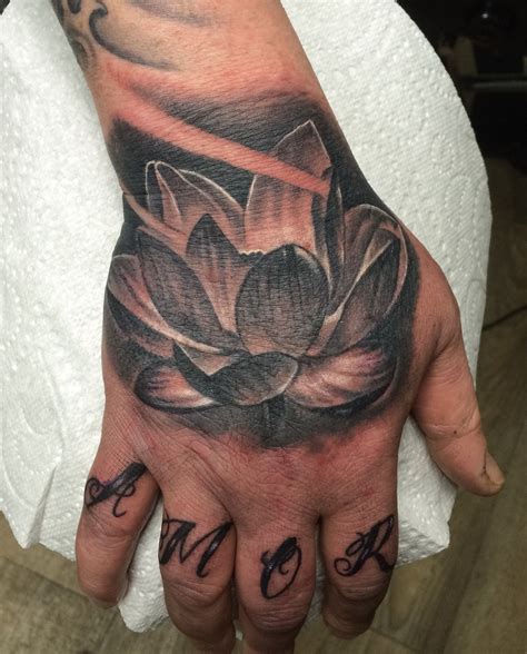 Lotus Flower Hand Tattoo