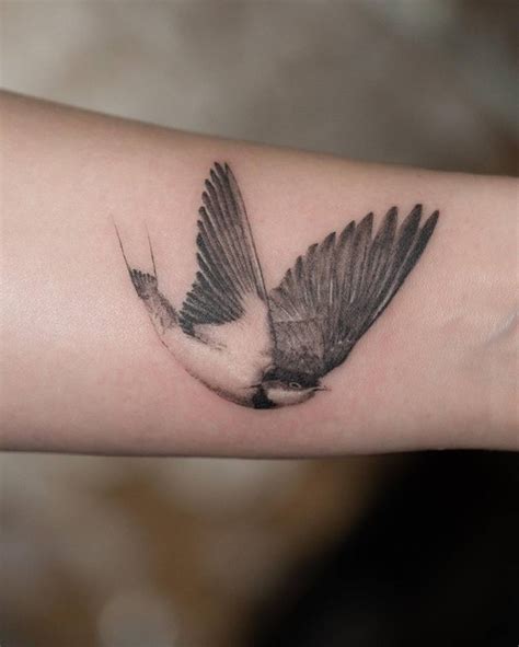 Micro Realistic Swallow Tattoo Located On The Wrist