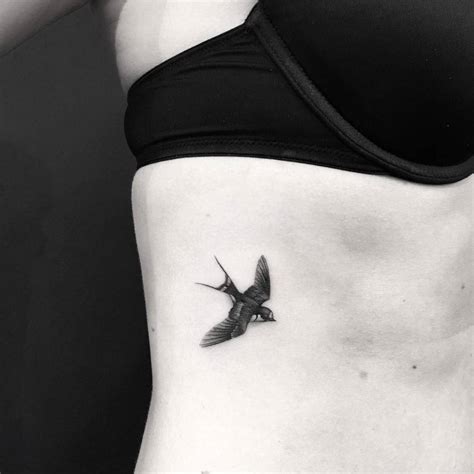 Micro Realistic Swallow Tattoo On The Rib