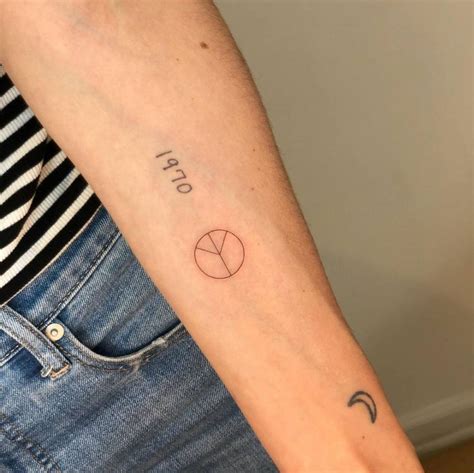 Minimalist Peace Symbol Tattoo On The Inner Forearm