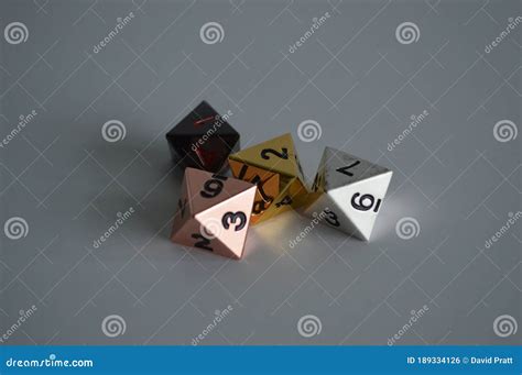 Multiple D8 Eight Sided Dice Die Copper Silver Gold Black Stock Photo