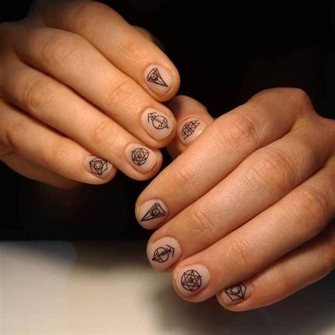 8 Nail Tattoo Designs to Elevate Your Style