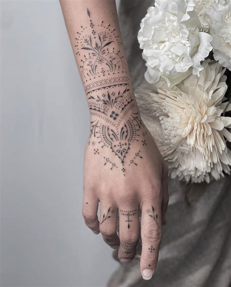 Ornamental Henna Hand Tattoo