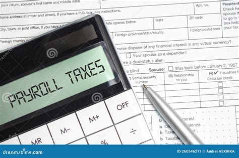 Payroll Taxes Words On Calculator Display And Tax Forms Stock Image