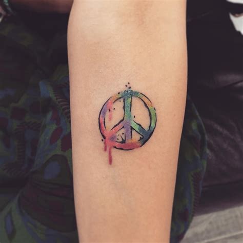 7 Meaningful Peace Symbol Tattoo Designs to Inspire