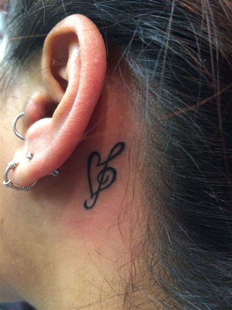 Playboy Tattoo Behind Ear