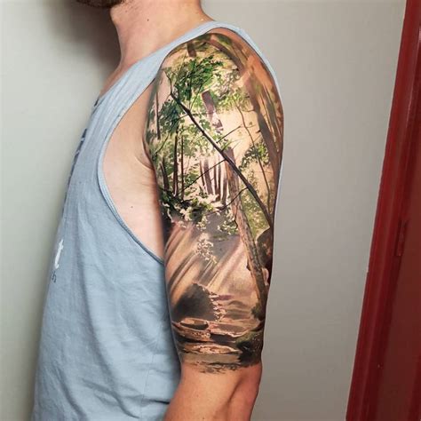 Realistic Forest Tattoo On The Left Upper Arm