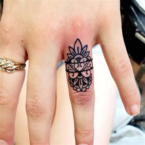 Ring Design Tattoo Inspiration and Meaning