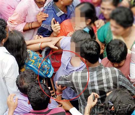 Shocking Photographs Of Three Perverts Molesting A Woman During A Religious Festival In Mumbai