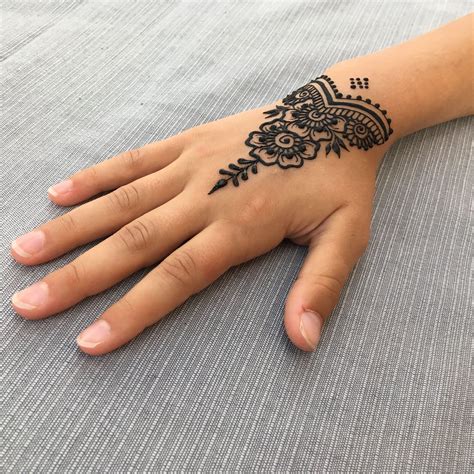 Simple Small Henna Hand Tattoo