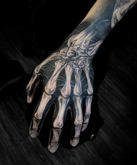 Skeleton Hand Tattoo Designs and Meanings Revealed