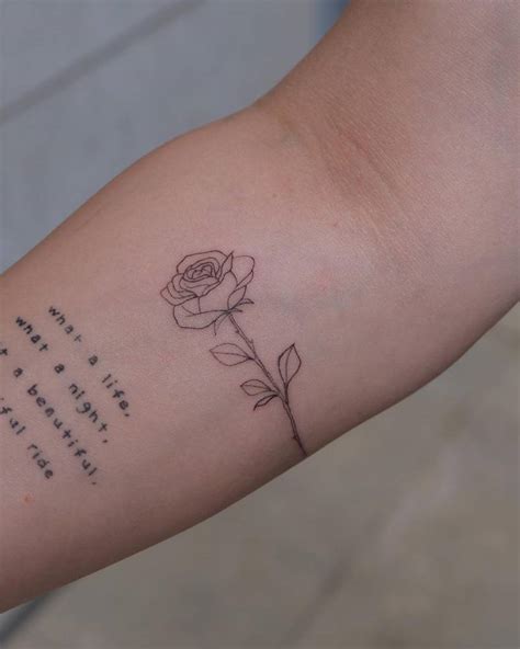 Small Fine Line Style Rose Tattoo On The Right Forearm