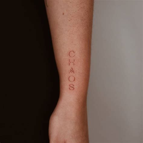 Tattoo Of The Word Amp Quot Chaos Amp Quot Located On The Wrist