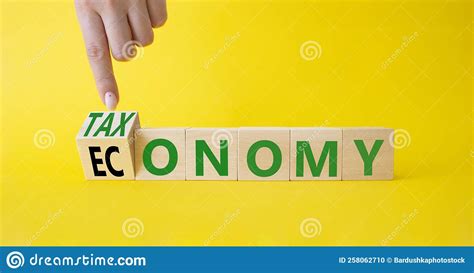 Taxonomy And Economy Symbol Turned Cubes With Words Economy And