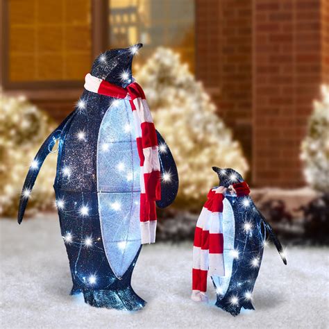 The Twinkling Christmas Penguins Hammacher Schlemmer