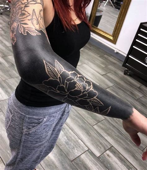 These Striking Solid Black Tattoos Will Make You Want To Go All In