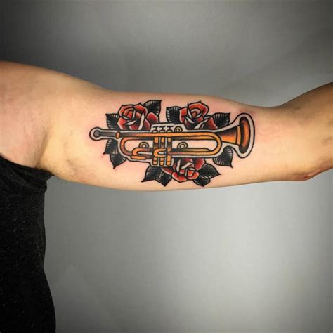 Traditional Style Trumpet Tattoo On The Left Inner Arm