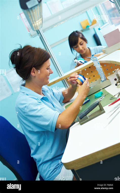 Two Dental Technicians Working In A Dental Laboratory Stock Photo Alamy