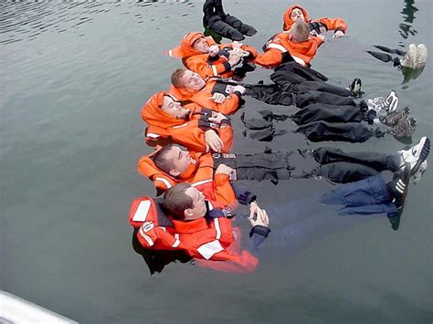 U S Coast Guard Members Practice Cold Water Survival By Grouping