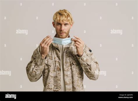 White Military Man Wearing Uniform Posing With Protective Mask Isolated