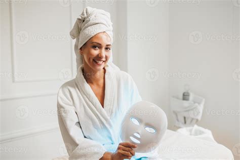 Woman Getting A Led Light Facial Mask Treatment At The Beauty Salon