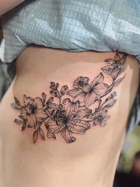 10 Lovely Women's Rib Tattoo Designs