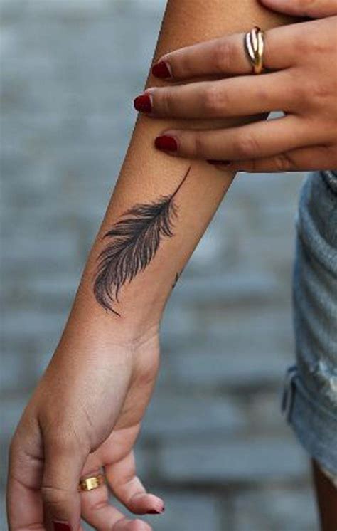 7 Delicate Wrist Female Feather Tattoo Design Ideas